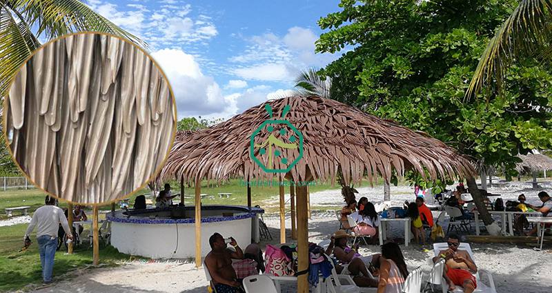 Application of fake palm leaf thatch roof for various commercial park, garden, landscape tiki restaurant, beach umbrella