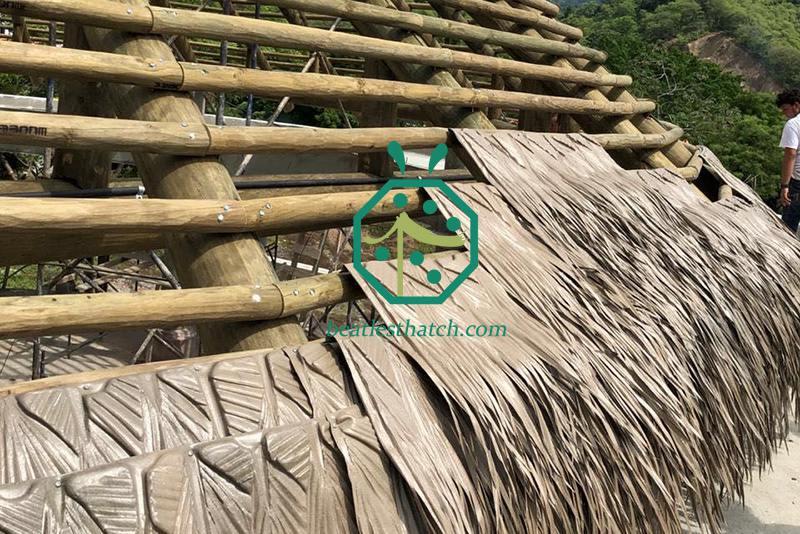 Synthetic viva palm fronds thatch roof used for garden shed, resort palapa, tiki hut restaurant, theme park bali hut, beach house, gazebo, overwater bungalow construction